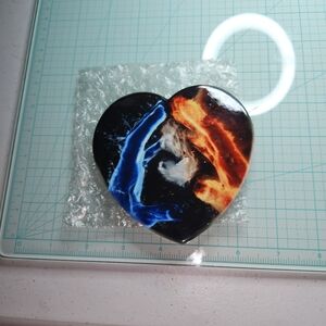 Vibrant Heart-Shaped Decorative Piece - Black, Blue, and Orange